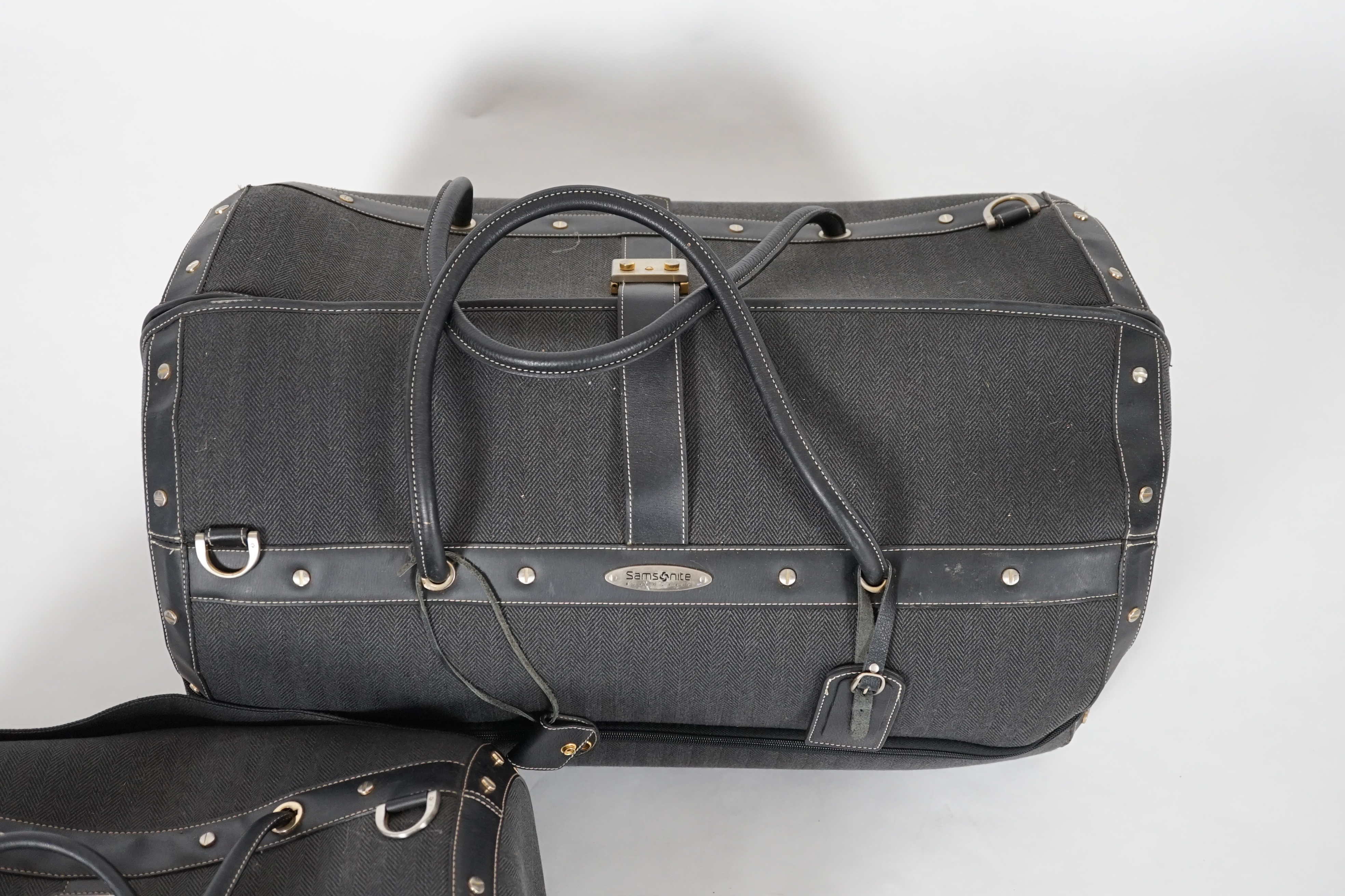 Two Samsonite Black Label charcoal herringbone holdalls, 62cm x 34cm x 40cm and 48cm x 28cm x 34cm